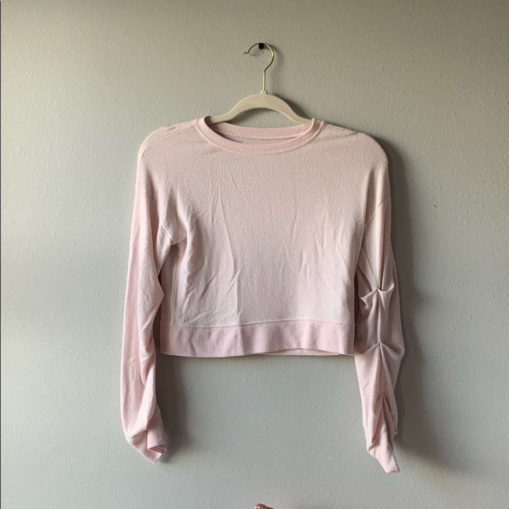 Pink sweater.